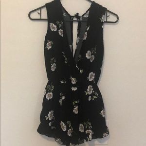 Black floral romper with tie back and pockets